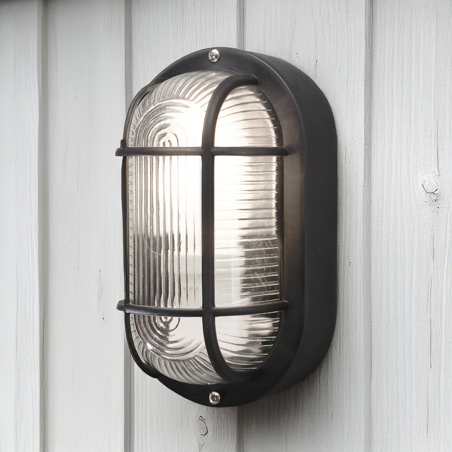 Konstsmide 7650-750 Elmas Bulk Head Outdoor Wall Light Mains Powered / W: 12cm D: 10.5cm H: 20cm / 1 x 40 W E27 Max Wall Lamp / Clear Ribbed Glass / Plastic / IP44 / Outside Light Black